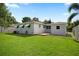 Spacious backyard view with patio area, lush lawn, and well-maintained exterior at 1322 Morris Ave, Orlando, FL 32803