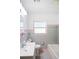 Bathroom featuring a bathtub, toilet, vanity, and classic tile work at 1322 Morris Ave, Orlando, FL 32803