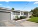Attractive single-story home with well manicured bushes and attached garage at 1322 Morris Ave, Orlando, FL 32803