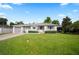 Charming single-story home with a well-maintained lawn and mature landscaping at 1322 Morris Ave, Orlando, FL 32803