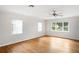 Bright room with hardwood floors, three windows offering lots of natural light and ceiling fan at 1322 Morris Ave, Orlando, FL 32803