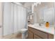Bathroom with shower, toilet, sink, wall cabinet and neutral walls at 13478 Summer Rain Dr, Orlando, FL 32828