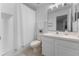 Bathroom with a shower-tub combo, white vanity, and a neutral color scheme, offering a clean and functional space at 13478 Summer Rain Dr, Orlando, FL 32828