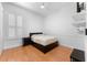 Well lit bedroom with window, wood flooring, and closet provides comfort and functionality at 13478 Summer Rain Dr, Orlando, FL 32828