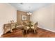 Cozy dining room featuring a chandelier and comfortable seating for four at 13478 Summer Rain Dr, Orlando, FL 32828