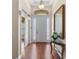 Inviting foyer with hardwood floors, high ceilings, and elegant decor at 13478 Summer Rain Dr, Orlando, FL 32828