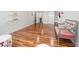 Spacious basement with wood-look flooring, bright white walls, and built-in shelving for storage at 1350 Lyndale Blvd, Winter Park, FL 32789