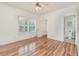 This bedroom features hardwood floors, plantation shutters, and an attached bathroom at 1350 Lyndale Blvd, Winter Park, FL 32789