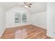 Vaulted bedroom featuring hardwood floors and a large window at 1350 Lyndale Blvd, Winter Park, FL 32789
