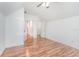 Bright bedroom featuring wood floors, multiple doors, and ample closet space at 1350 Lyndale Blvd, Winter Park, FL 32789