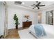Serene bedroom offers a cozy retreat with ample natural light and stylish decor at 1350 Lyndale Blvd, Winter Park, FL 32789