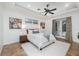 Inviting bedroom features neutral tones, plush bedding, and access to a private outdoor space at 1350 Lyndale Blvd, Winter Park, FL 32789