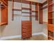 Spacious walk-in closet with custom shelving, drawers, and ample storage for wardrobe and accessories at 1350 Lyndale Blvd, Winter Park, FL 32789