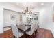 Elegant dining room featuring hardwood floors, a chandelier, and an open layout at 1350 Lyndale Blvd, Winter Park, FL 32789