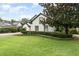 Charming two-story home with lush landscaping and a well-manicured lawn at 1350 Lyndale Blvd, Winter Park, FL 32789