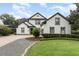 Charming two-story home with lush landscaping and a well-manicured lawn at 1350 Lyndale Blvd, Winter Park, FL 32789