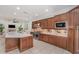 Gourmet kitchen featuring a large island, custom cabinets, stainless steel appliances, and open design at 1350 Lyndale Blvd, Winter Park, FL 32789