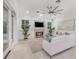 Bright living room features a fireplace, comfortable seating, and a view of the pool area at 1350 Lyndale Blvd, Winter Park, FL 32789