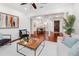 Elegant living room showcasing hardwood floors, stylish decor, and an open floor plan with a dining area at 1350 Lyndale Blvd, Winter Park, FL 32789