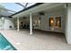 Covered lanai area with white columns, ceiling fans, and brick paver decking by the pool at 1350 Lyndale Blvd, Winter Park, FL 32789