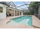 Stunning in-ground pool and hot tub in a screened enclosure with brick paver deck at 1350 Lyndale Blvd, Winter Park, FL 32789