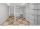 Organized walk-in closet with shelving and ample storage space, featuring tiled floors at 1350 Lyndale Blvd, Winter Park, FL 32789