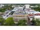 Stunning aerial view showcasing the building's architecture and surrounding city landscape with lush green trees at 140 E Morse Blvd # C, Winter Park, FL 32789