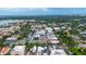 Beautiful aerial view of the city with lush trees, buildings, and a lake in the background at 140 E Morse Blvd # C, Winter Park, FL 32789
