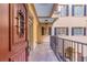 Balcony with black iron railings, stone floors, and a view of the exterior of the property at 140 E Morse Blvd # C, Winter Park, FL 32789