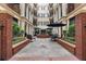 Charming courtyard featuring a fountain, seating, and lush greenery for a relaxing outdoor space at 140 E Morse Blvd # C, Winter Park, FL 32789