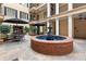 Tranquil courtyard with a central fountain, comfortable seating, and mature plants creating a peaceful retreat at 140 E Morse Blvd # C, Winter Park, FL 32789