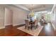 Dining room area with dark hardwood floors and a view of the living room at 140 E Morse Blvd # C, Winter Park, FL 32789