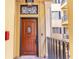 Elegant brown front door with decorative window and black hardware at 140 E Morse Blvd # C, Winter Park, FL 32789