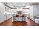 Spacious white kitchen features a large center island, granite countertops and stainless appliances at 140 E Morse Blvd # C, Winter Park, FL 32789
