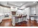 Gourmet kitchen boasts granite countertops, white cabinetry, and a central island with seating at 140 E Morse Blvd # C, Winter Park, FL 32789