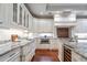 Close up of elegant kitchen with granite countertops, stainless steel appliances, and custom cabinetry at 140 E Morse Blvd # C, Winter Park, FL 32789