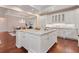 Well-appointed kitchen features white cabinets, granite countertops and a view into adjacent dining area at 140 E Morse Blvd # C, Winter Park, FL 32789