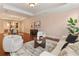 Open-concept living room with wood floors leads to dining room with elegant furniture at 140 E Morse Blvd # C, Winter Park, FL 32789
