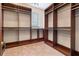 Spacious walk-in closet with custom wood shelving and ample storage for clothes and accessories at 140 E Morse Blvd # C, Winter Park, FL 32789