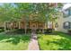 Charming front exterior with well-manicured lawn and brick path leading to the entrance at 14897 Evergreen Oak Loop, Winter Garden, FL 34787