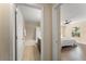 Hallway featuring an open view into the bathroom and primary bedroom at 14897 Evergreen Oak Loop, Winter Garden, FL 34787