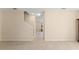 Neutral living area showcasing tile floors, staircase, and minimalist design at 14897 Evergreen Oak Loop, Winter Garden, FL 34787