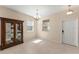 Open-plan living room showcasing tile floors, natural light, and dining area at 14897 Evergreen Oak Loop, Winter Garden, FL 34787