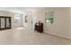Bright living room with tile floors, large windows, and elegant furnishings at 14897 Evergreen Oak Loop, Winter Garden, FL 34787