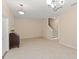 Inviting living area with staircase, tile flooring, and abundant natural light at 14897 Evergreen Oak Loop, Winter Garden, FL 34787