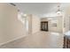 Open living area featuring tile flooring, a staircase, and neutral decor at 14897 Evergreen Oak Loop, Winter Garden, FL 34787