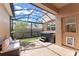 Relaxing screened patio with hot tub, stylish seating, and beautiful outdoor ambiance at 14897 Evergreen Oak Loop, Winter Garden, FL 34787