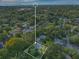 An aerial outline of the property amidst a vibrant, green landscape, offering privacy and seclusion at 1630 Lakeview Ct, Eustis, FL 32726