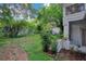 Spacious backyard with mature trees and partial fencing at 1630 Lakeview Ct, Eustis, FL 32726
