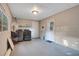 Basement area featuring washer, dryer, door and window for natural light at 1630 Lakeview Ct, Eustis, FL 32726